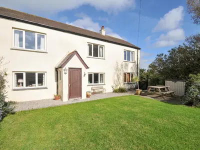 an exterior view of a house with a yard at Rosewin Farmhouse in Wadebridge