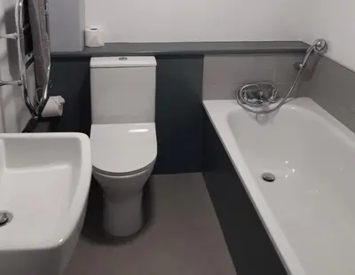 a bathroom with a white toilet and a sink at The Fourways Inn in Saint Minver