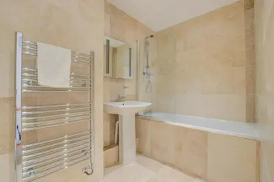 a bathroom with a sink and a toilet and a tub at 2 Bed in St Ives oc-bpp03 in St Ives