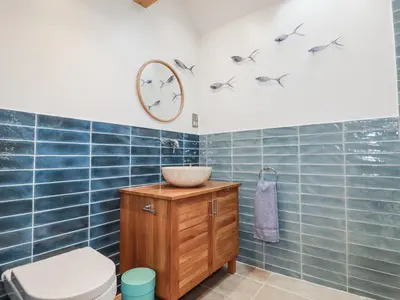 a bathroom with a sink and a toilet at The Old Dairy in Bodmin