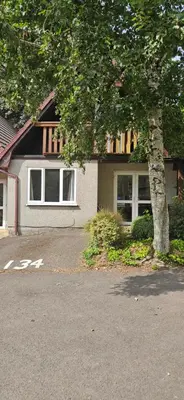 a house with a tree in front of it at Family and dog-friendly holiday home - 134 Hengar Manor in Saint Tudy