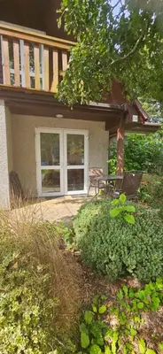 a house with a porch with a picnic table in front at Family and dog-friendly holiday home - 134 Hengar Manor in Saint Tudy