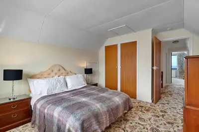 a hotel room with a large bed and a dresser at Finest Retreats - Michel in Carbis Bay