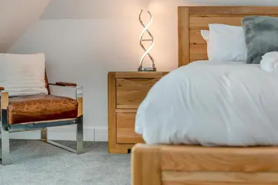 a bedroom with a bed and a chair at 2 Bed in Tintagel oc-g33170 in Tintagel