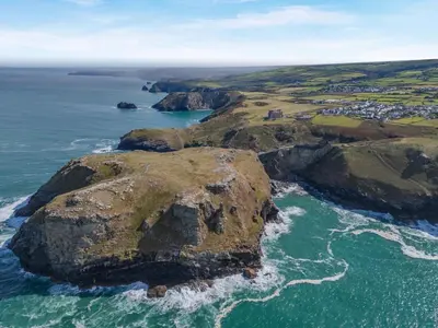 an aerial view of a rocky island in the ocean at 2 Bed in Tintagel oc-g33170 in Tintagel