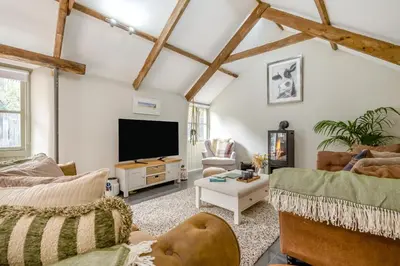 a large living room with a flat screen tv at 1 Bed in Newquay oc-c33290 in Saint Columb Major