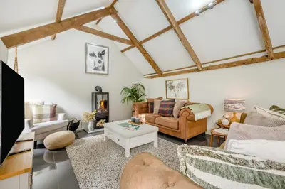 a living room with a couch and a table at 1 Bed in Newquay oc-c33290 in Saint Columb Major