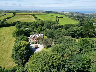 an aerial view of a house in a field at The Old Vicarage in Truro