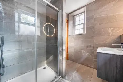 a bathroom with a shower and a sink at The Old Vicarage in Truro