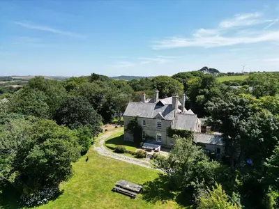 an aerial view of an old house in the countryside at The Old Vicarage in Truro