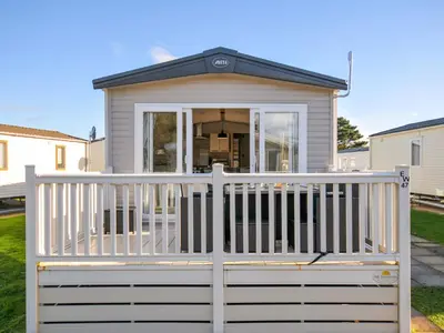 a screened in porch with a white fence at Eden Way 47 in Par
