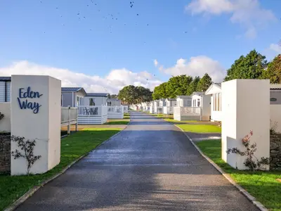 a road leading to a row of white houses at Eden Way 47 in Par