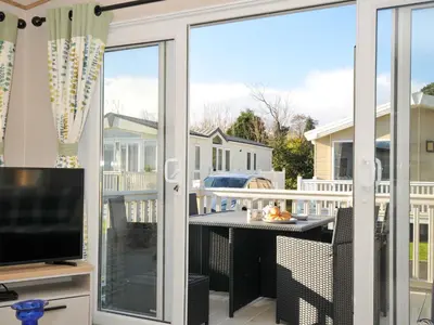 a screened in porch with a sliding glass door at Eden Way 47 in Par