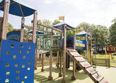 a playground with a slide in a park at Atlantic Lodge - 4 Bedroom - Pool -Spa - Gym in Newquay