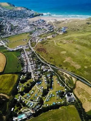 an aerial view of a city with the ocean at The Lodge in Perranporth