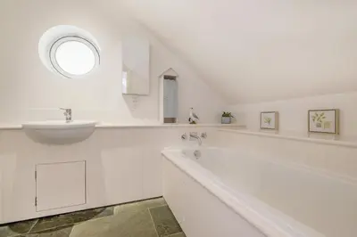 a white bathroom with a sink and a tub at 5 Bed in Rock oc-m33185 in Roche
