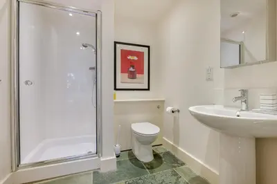 a bathroom with a shower and a toilet and a sink at 5 Bed in Rock oc-m33185 in Roche