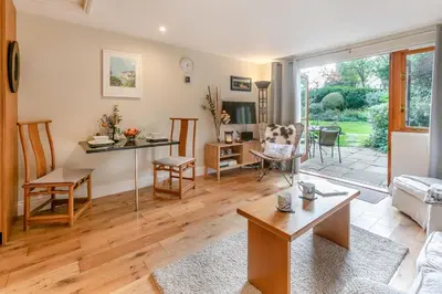 a living room with a couch and a table at 1 Bed in Fowey oc-p33360 in Fowey