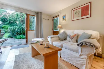 a living room with a couch and a table at 1 Bed in Fowey oc-p33360 in Fowey