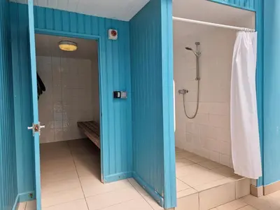 a bathroom with a shower with blue walls at 1 Bed in Fowey oc-p33360 in Fowey