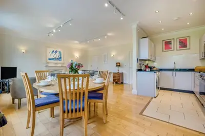 a kitchen and dining room with a table and chairs at 3 Bed in Fowey oc-o33078 in Fowey