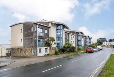 an apartment building on the side of a street at 12 Ocean One in Newquay