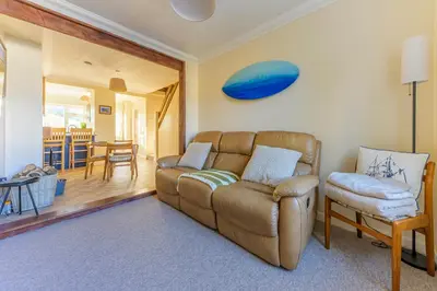 a living room with a couch and a chair at Danny Cottage in Saint Dennis