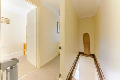 a bathroom with a mirror on the wall at Danny Cottage in Saint Dennis