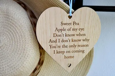 a wooden heart hanging from a hat at Sweetpea - Near Newquay - a tranquil hideaway in Saint Dennis