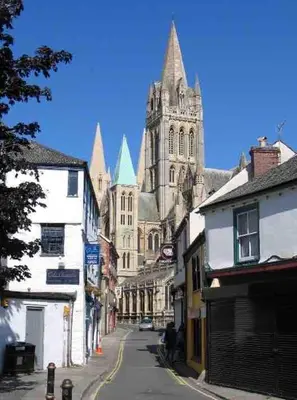 a city street with a large cathedral in the background at The Lodge in Truro