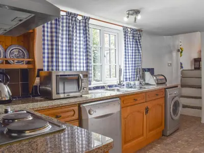 a kitchen with a sink and a dishwasher at Nutmeg's - Uk50373 in Camelford