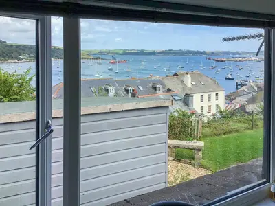 a view of a harbor from the window of a house at The Loft - Uk50517 in Falmouth