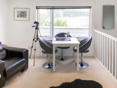 a room with a table and two chairs and a camera at The Loft - Uk50517 in Falmouth