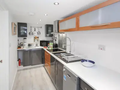 a kitchen with a sink and a counter top at The Loft - Uk50517 in Falmouth