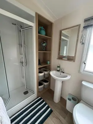 a bathroom with a shower and a sink at L20 at Seven Bays Park in St Merryn