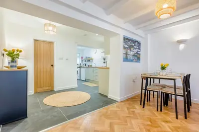 a kitchen and dining room with a table and chairs at 2 Bed in Wadebridge oc-m32567 in Wadebridge