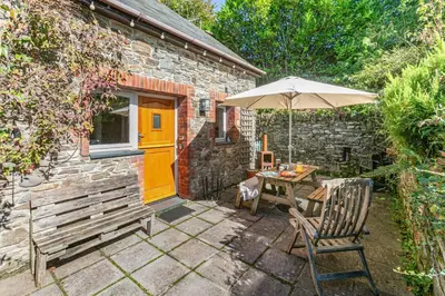 a patio with an umbrella and a table and chairs at 2 Bed in St. Martin oc-b33430 in Saint Martin