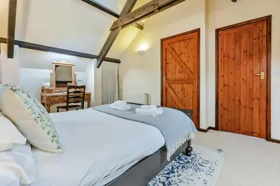 a bedroom with a bed and a wooden door at 2 Bed in St. Martin oc-b33430 in Saint Martin