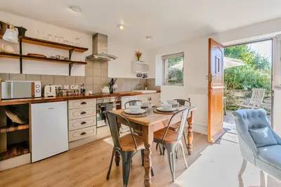 a kitchen with a wooden table and chairs at 2 Bed in St. Martin oc-b33430 in Saint Martin