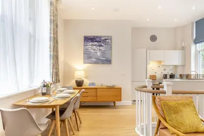 a kitchen and dining room with a table and chairs at 2 Bed in Fowey oc-n33435 in Fowey