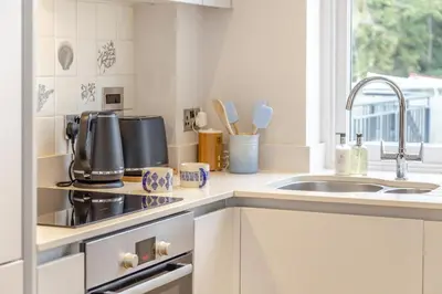 a kitchen with a sink and a stove top oven at 2 Bed in Fowey oc-n33435 in Fowey