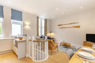 a kitchen and living room with a table and a dining room at 2 Bed in Fowey oc-n33435 in Fowey
