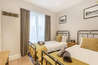 a bedroom with two beds and a window at 2 Bed in Fowey oc-n33435 in Fowey