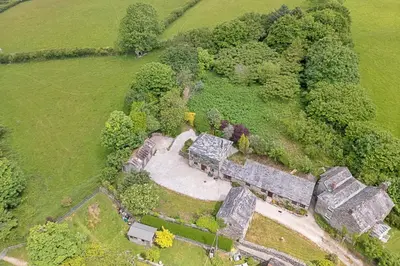 an overhead view of an old stone building in a field at Finest Retreats - Demelza Cottage in Blisland