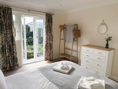 a bedroom with a bed with two towels on it at 42 Little Trelyn in Wadebridge
