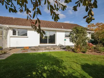 a house with a lawn in front of it at 42 Little Trelyn in Wadebridge