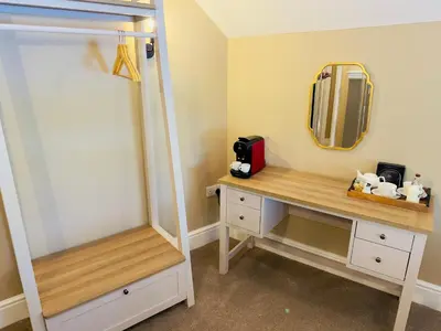 a room with a dressing table and a mirror at Rising Sun Inn - Rough Tor in Altarnun
