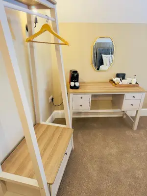 a dressing room with a desk and a mirror at Rising Sun Inn - Rough Tor in Altarnun