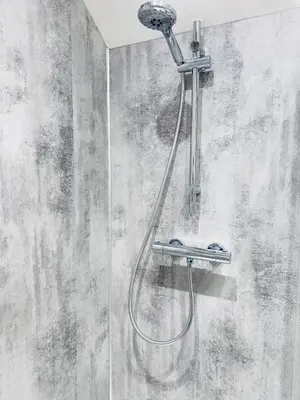 a shower with a shower head on a wall at Rising Sun Inn - Kil Margh in Altarnun