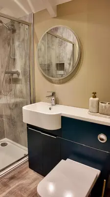 a bathroom with a sink and a shower at Rising Sun Inn - Kil Margh in Altarnun
